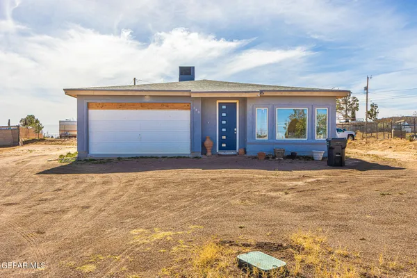 a backyard of a house with large trees