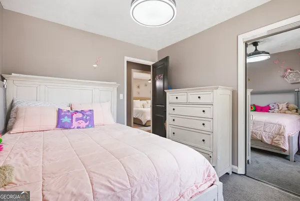 a bedroom with a bed and a bathroom