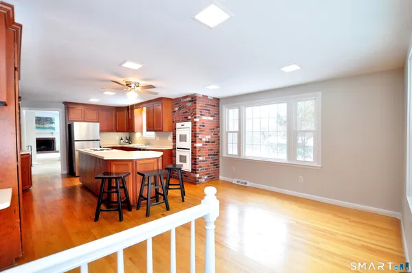 a view of a dining room and livingroom with furniture window