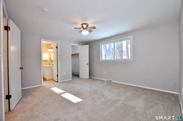 a view of an empty room with a window