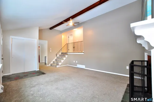 a view of an empty room with a window