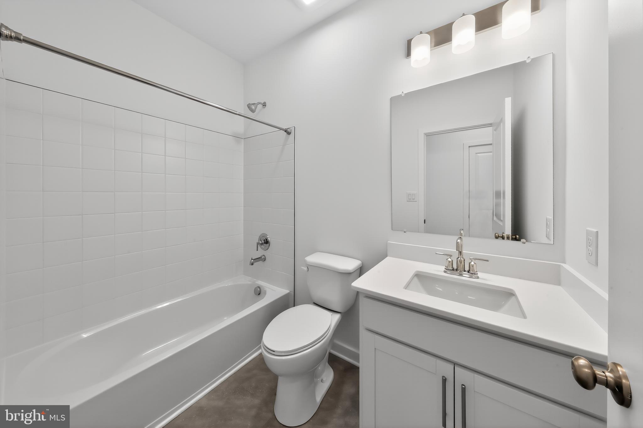 14966 Channel Run Ellendale, DE 19941 - Photo 11 of 21 a bathroom with a sink a toilet and shower
