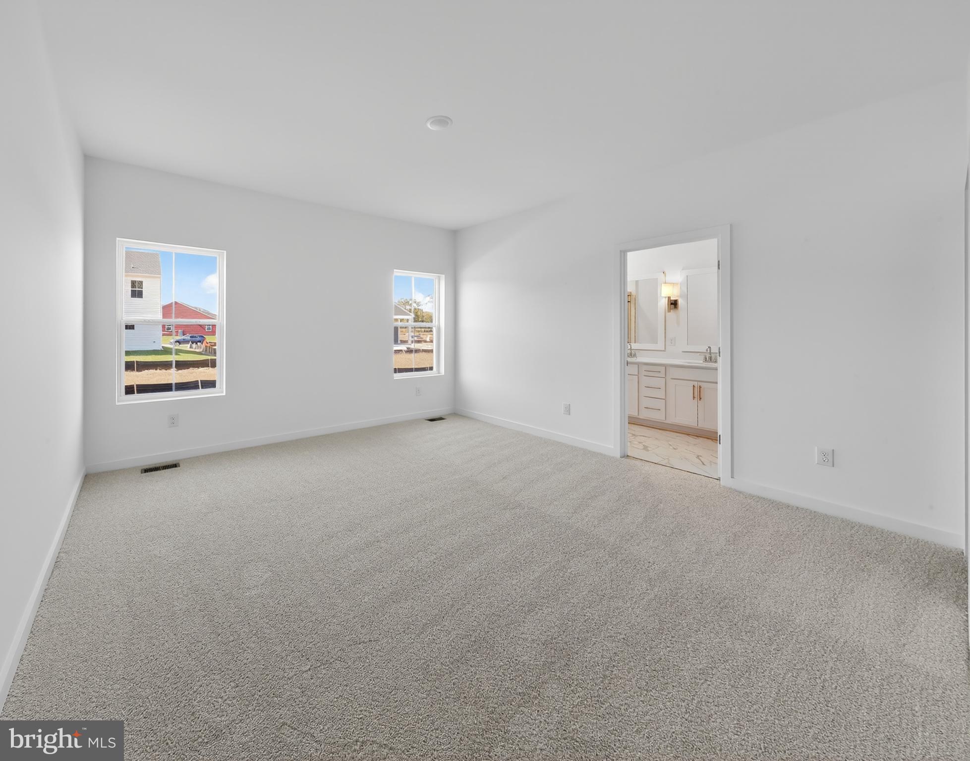 14966 Channel Run Ellendale, DE 19941 - Photo 12 of 21 an empty room with windows and closet