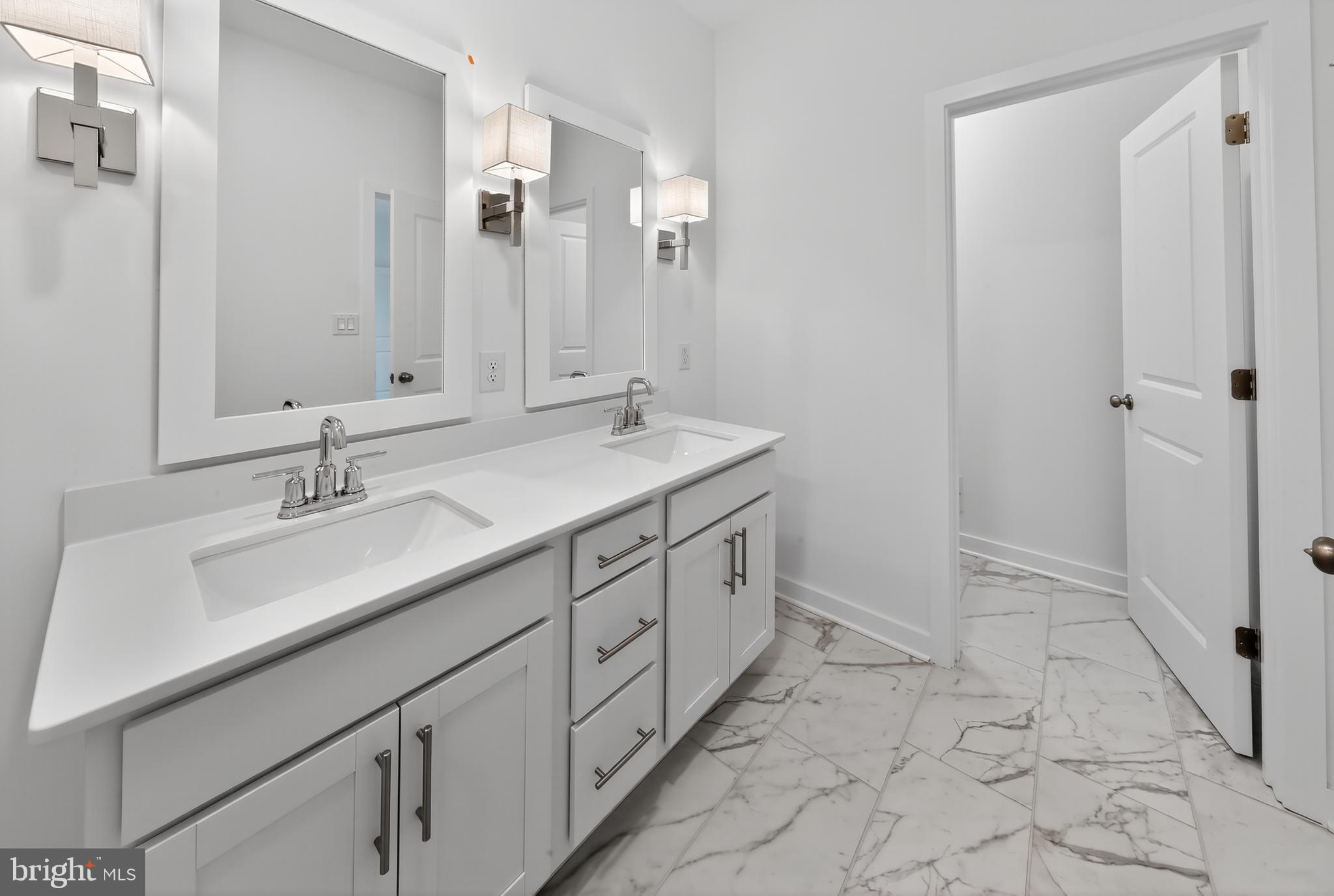 14966 Channel Run Ellendale, DE 19941 - Photo 14 of 21 a bathroom with a sink and a mirror