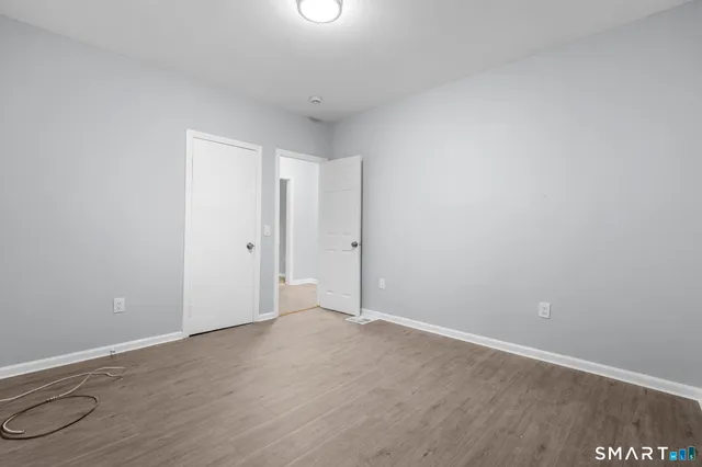 a kitchen with granite countertop a sink and cabinets