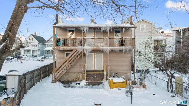 a view of a house with pool and sitting area