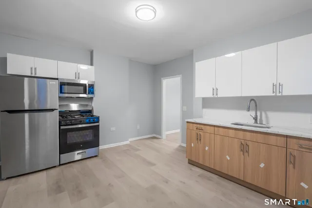 a view of a hallway view with staircase