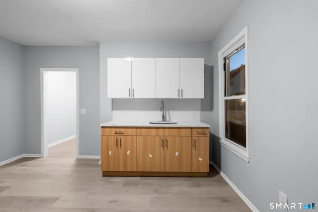 a bathroom with a sink toilet and a bathtub