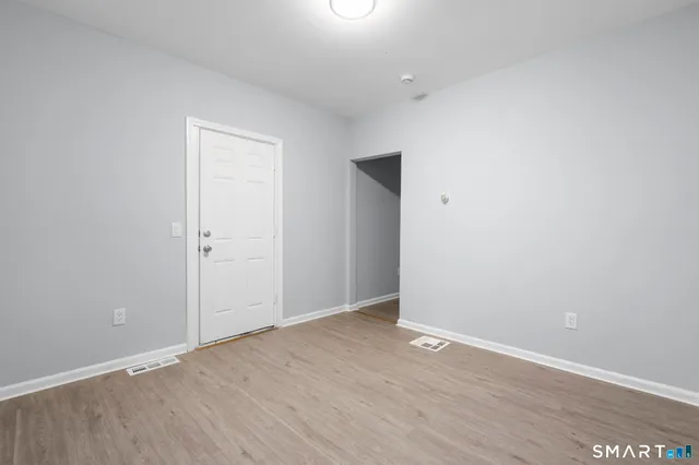 a view of a room with a large window