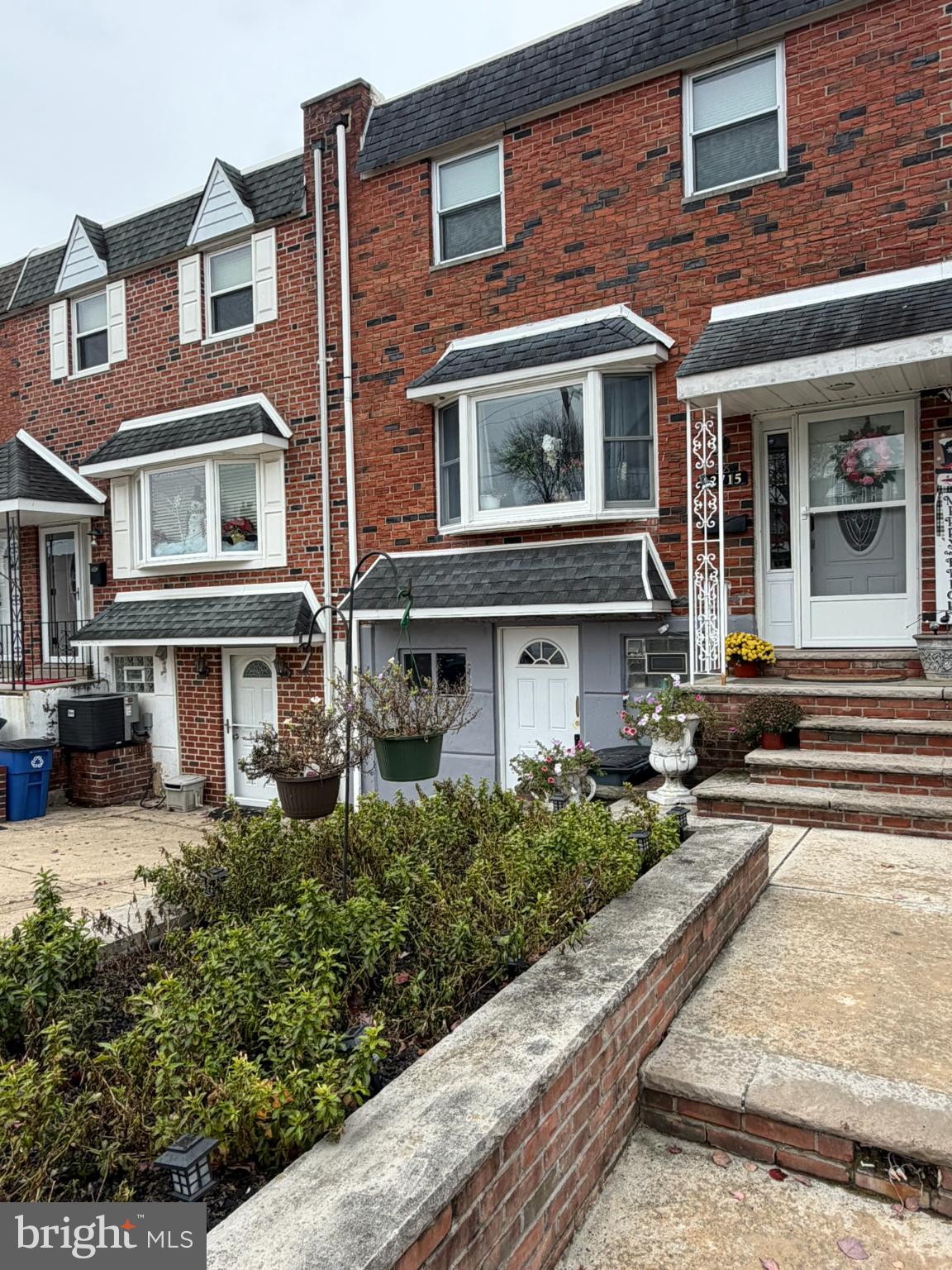 Charming brick townhome with inviting entrance.