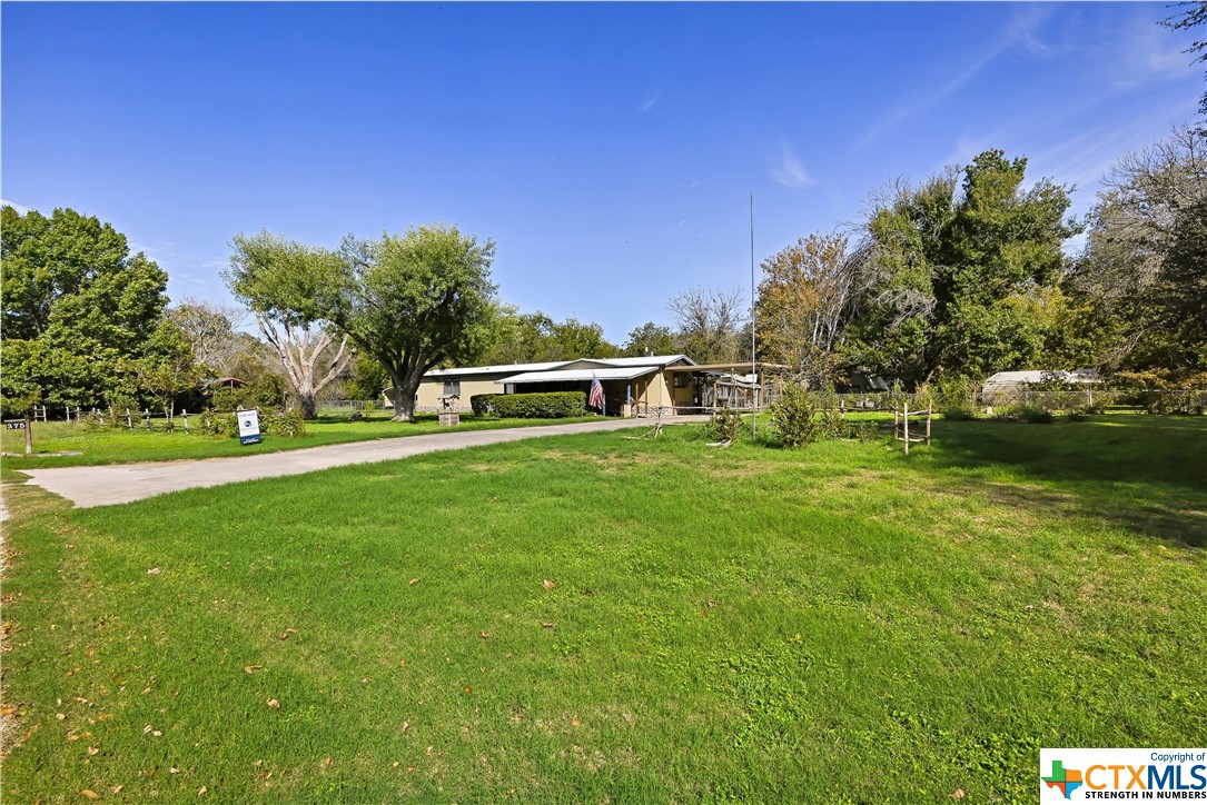 375 Willow Drive McQueeney, TX 78123 - Photo 1 of 1 a view of a green field with sitting area