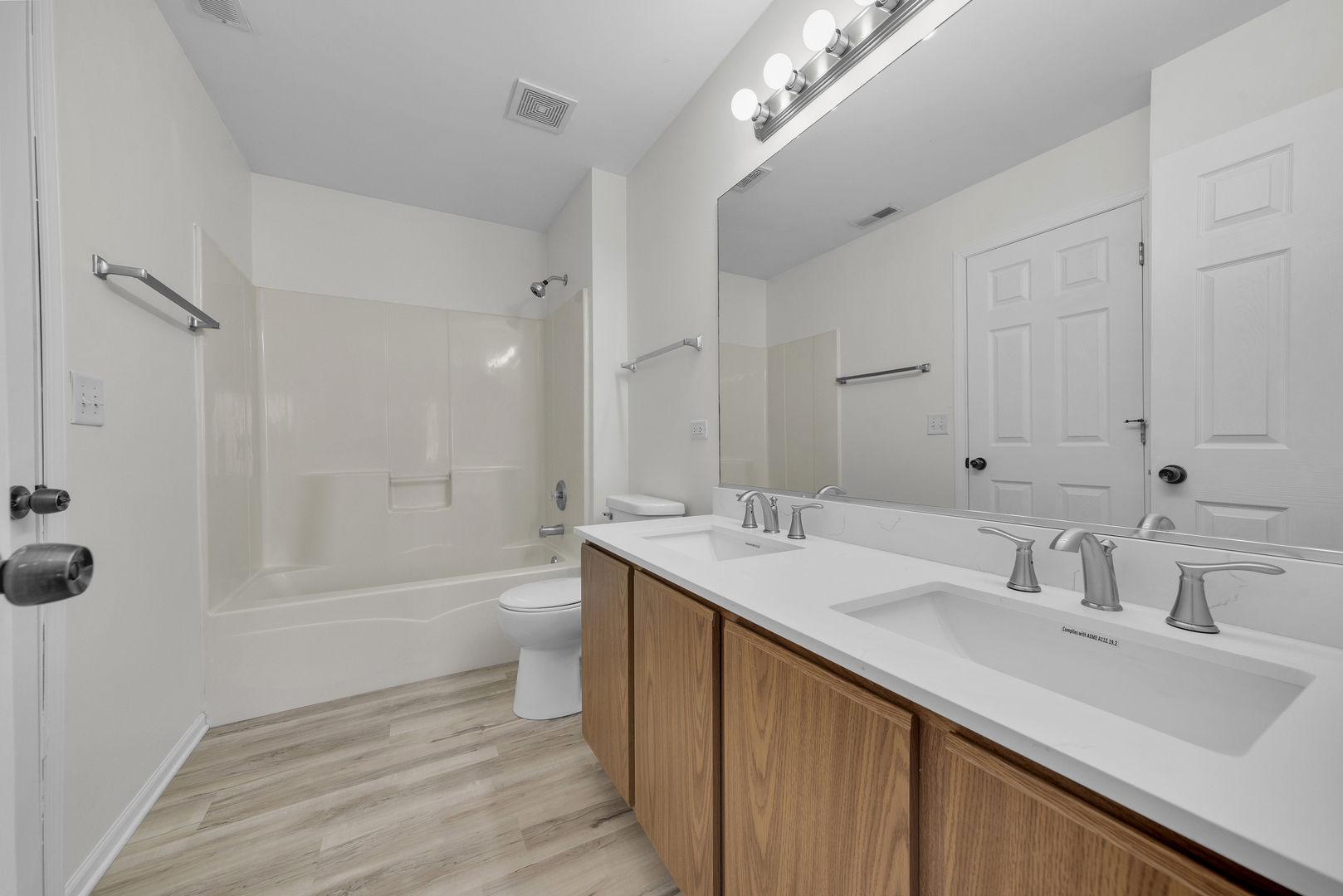 608 Chestnut Ridge Minooka, IL 60447 - Photo 12 of 16 a bathroom with a sink double vanity granite tub and a mirror