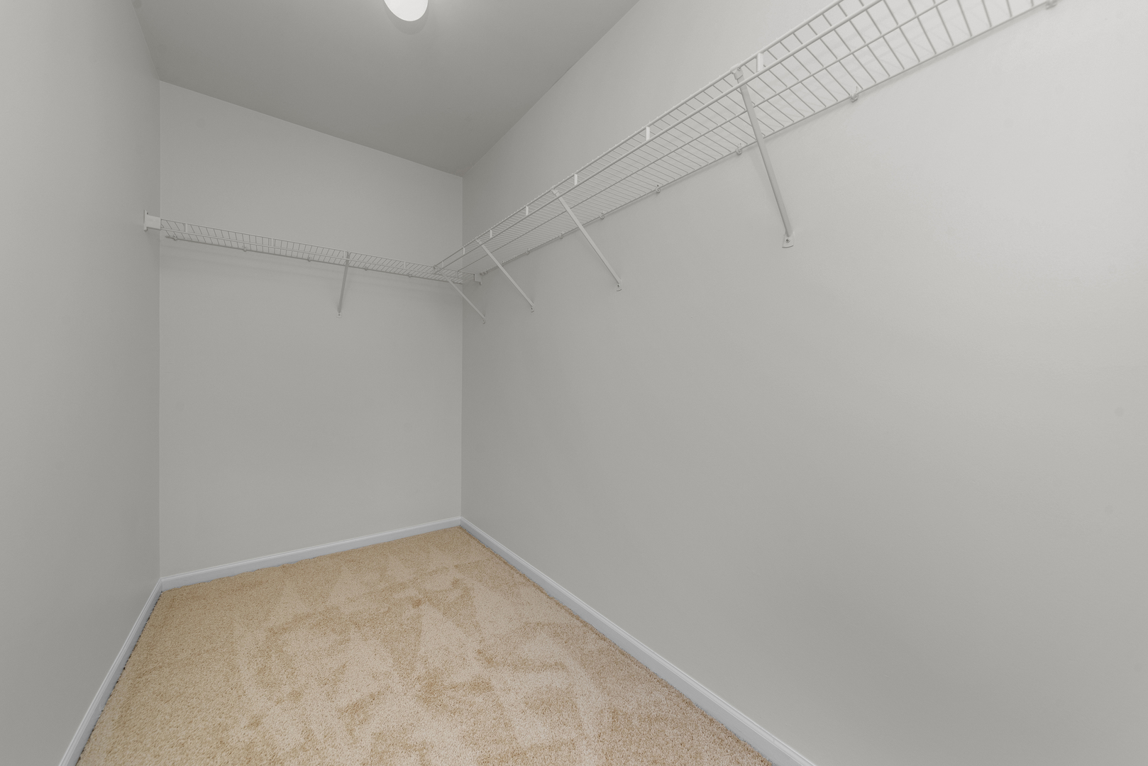 608 Chestnut Ridge Minooka, IL 60447 - Photo 13 of 16 a view of a room with racks on the wall