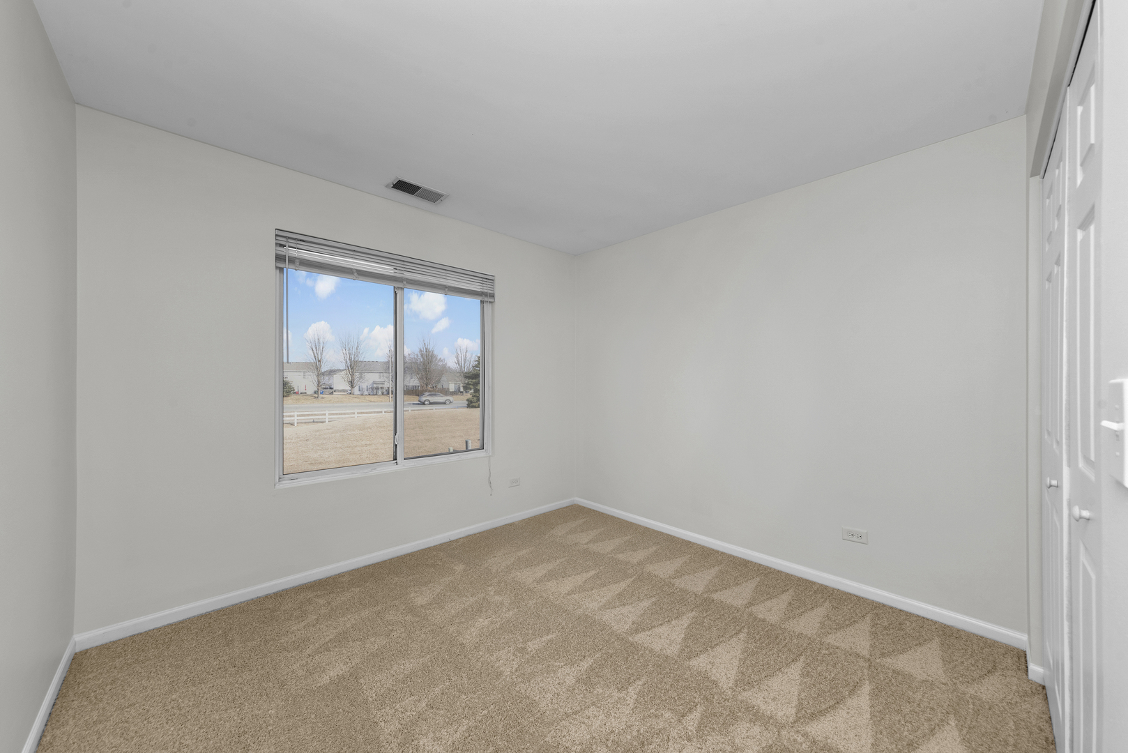 608 Chestnut Ridge Minooka, IL 60447 - Photo 14 of 16 an empty room with a window