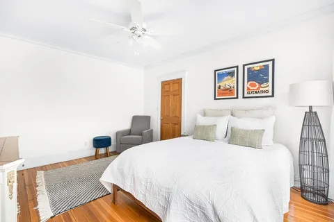 a bedroom with a bed and a lamp