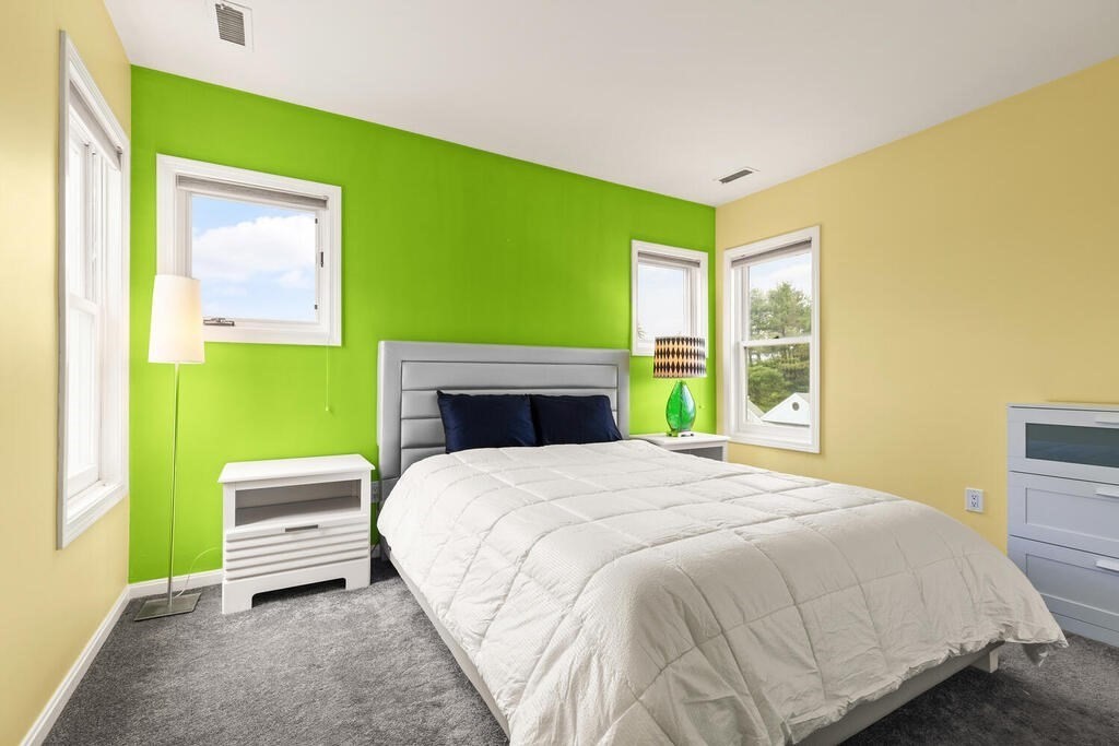 6 Pear Tree Drive Canton, MA 02021 - Photo 17 of 33 a bedroom with a bed and a flat screen tv