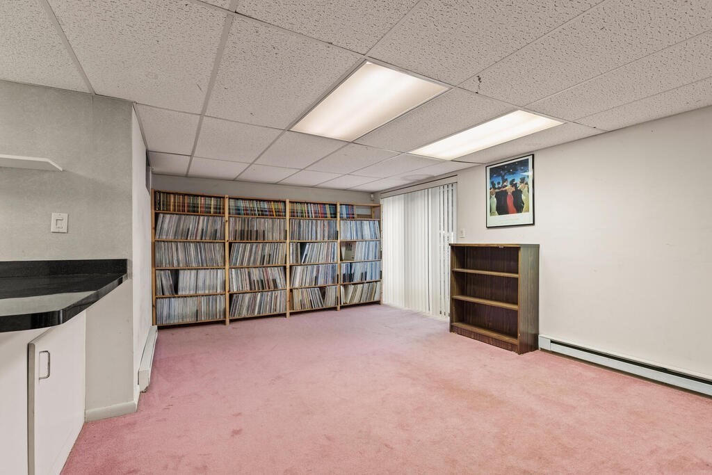 6 Pear Tree Drive Canton, MA 02021 - Photo 19 of 33 a view of an empty room with a fireplace and cabinet
