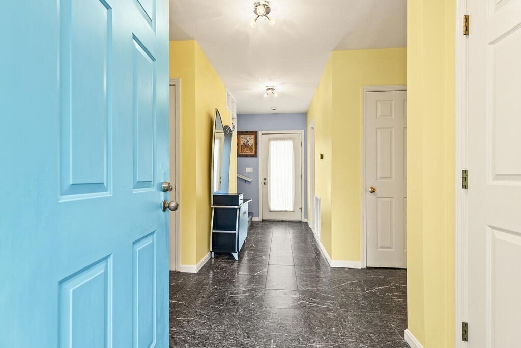 6 Pear Tree Drive Canton, MA 02021 - Photo 2 of 33 a view of a hallway with wooden floor