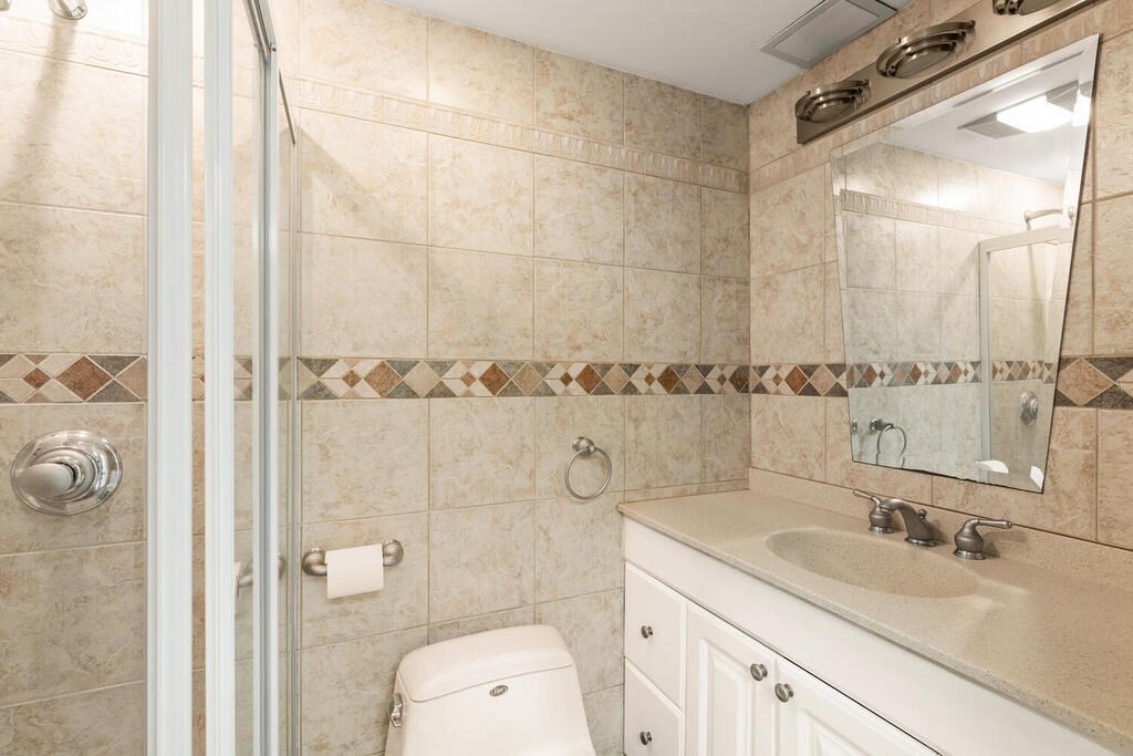 6 Pear Tree Drive Canton, MA 02021 - Photo 21 of 33 a bathroom with a granite countertop sink a toilet and a mirror