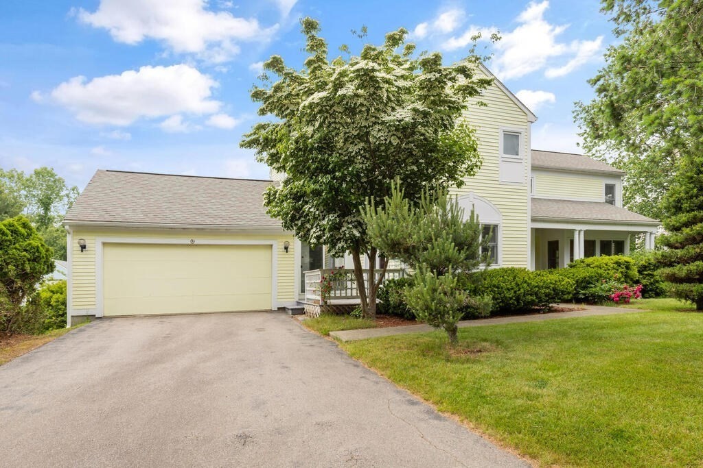 6 Pear Tree Drive Canton, MA 02021 - Photo 24 of 33 a front view of a house with a garden and yard