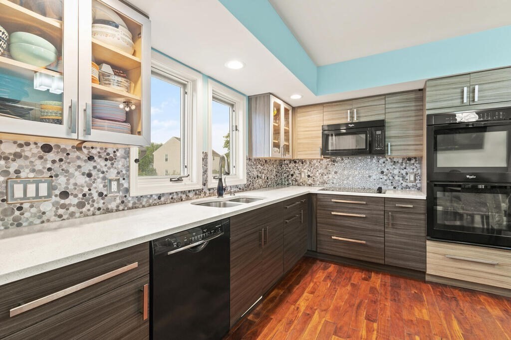 6 Pear Tree Drive Canton, MA 02021 - Photo 3 of 33 a kitchen with stainless steel appliances granite countertop a sink and stove top oven
