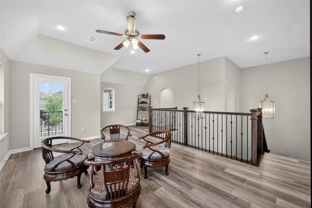 1039 Stephen Street Allen, TX 75013 - Photo 31 of 40 Sitting room with ceiling fan, recessed lighting, light wood finished floors, an upstairs landing, and vaulted ceiling