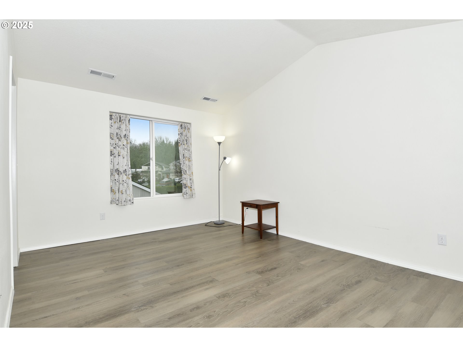 35550 Edie's Way St. Helens, OR 97051 - Photo 21 of 34 a view of an empty room and window and wooden floor