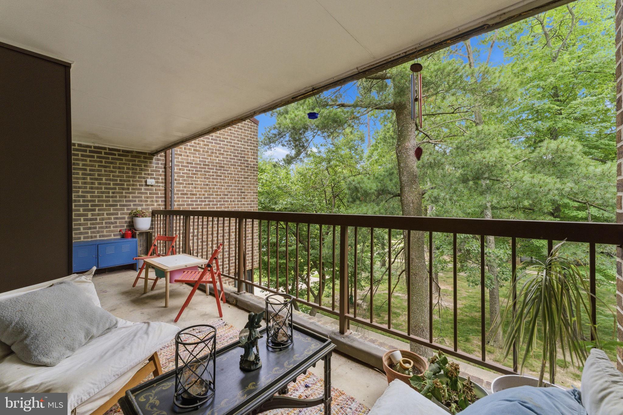 11260 Chestnut Grove Square, Unit 337 Reston, VA 20190 - Photo 32 of 82 Serene balcony with lush green views.