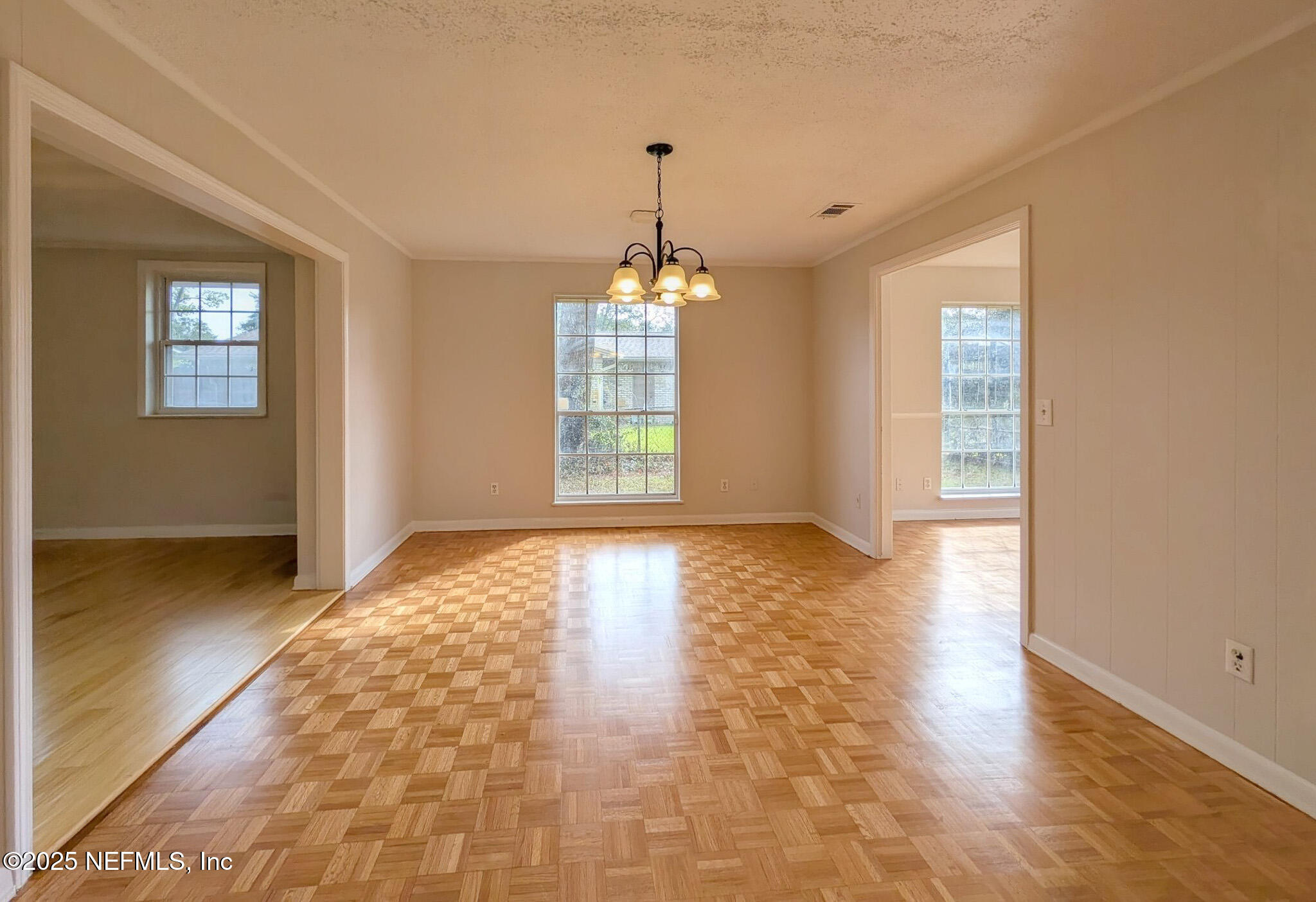 5091 Somersby Road Jacksonville, FL 32217 - Photo 4 of 19 a view of an empty room with wooden floor and a window