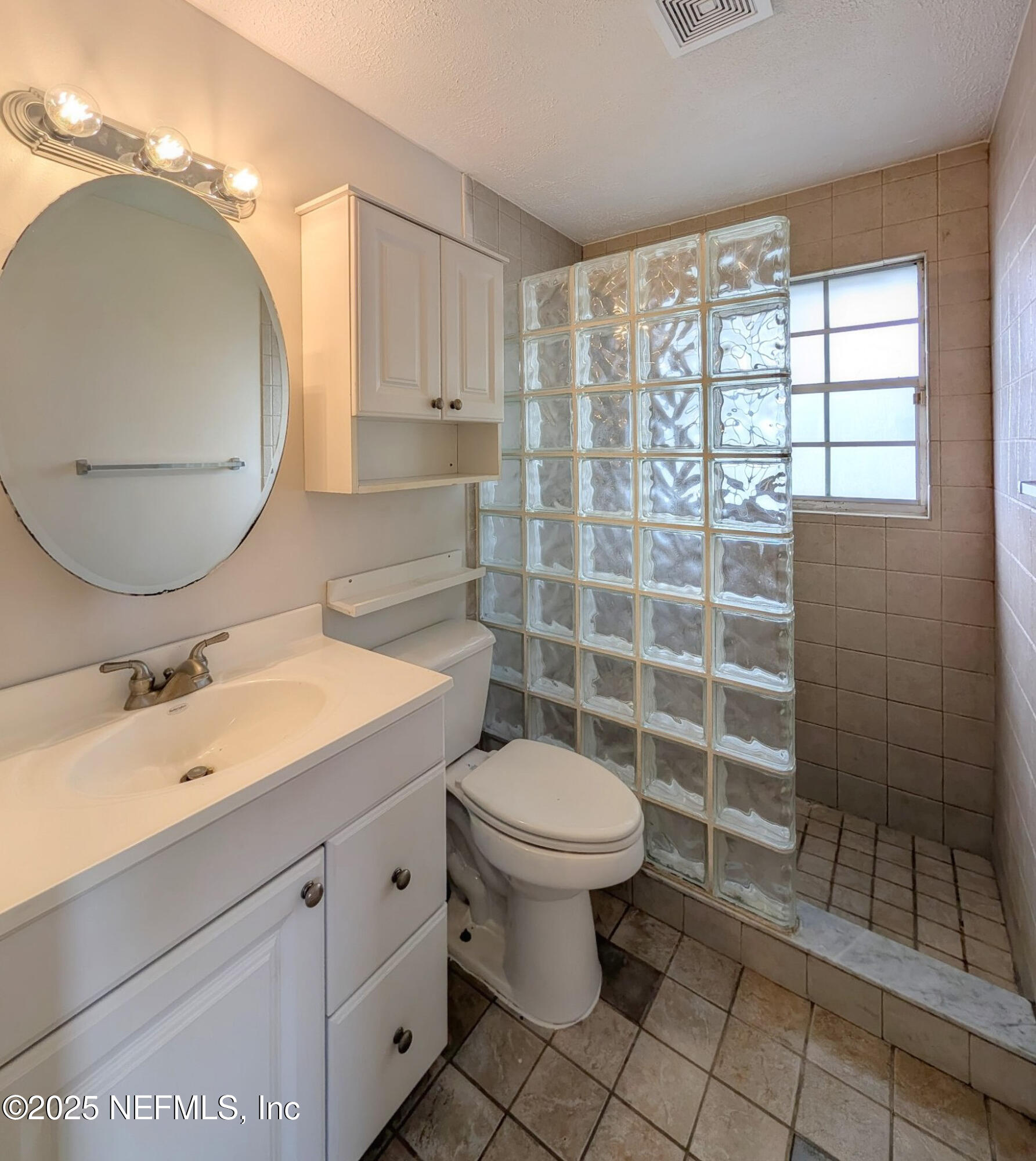 5091 Somersby Road Jacksonville, FL 32217 - Photo 9 of 19 a bathroom with a sink toilet and a mirror