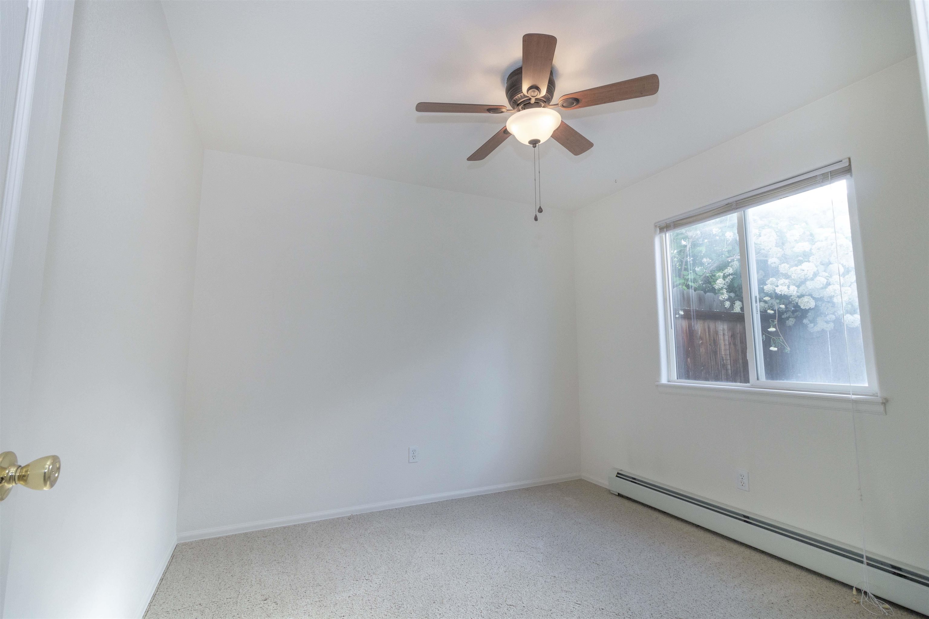 1386 Powell Street Fruita, CO 81521 - Photo 11 of 21 an empty room with a window