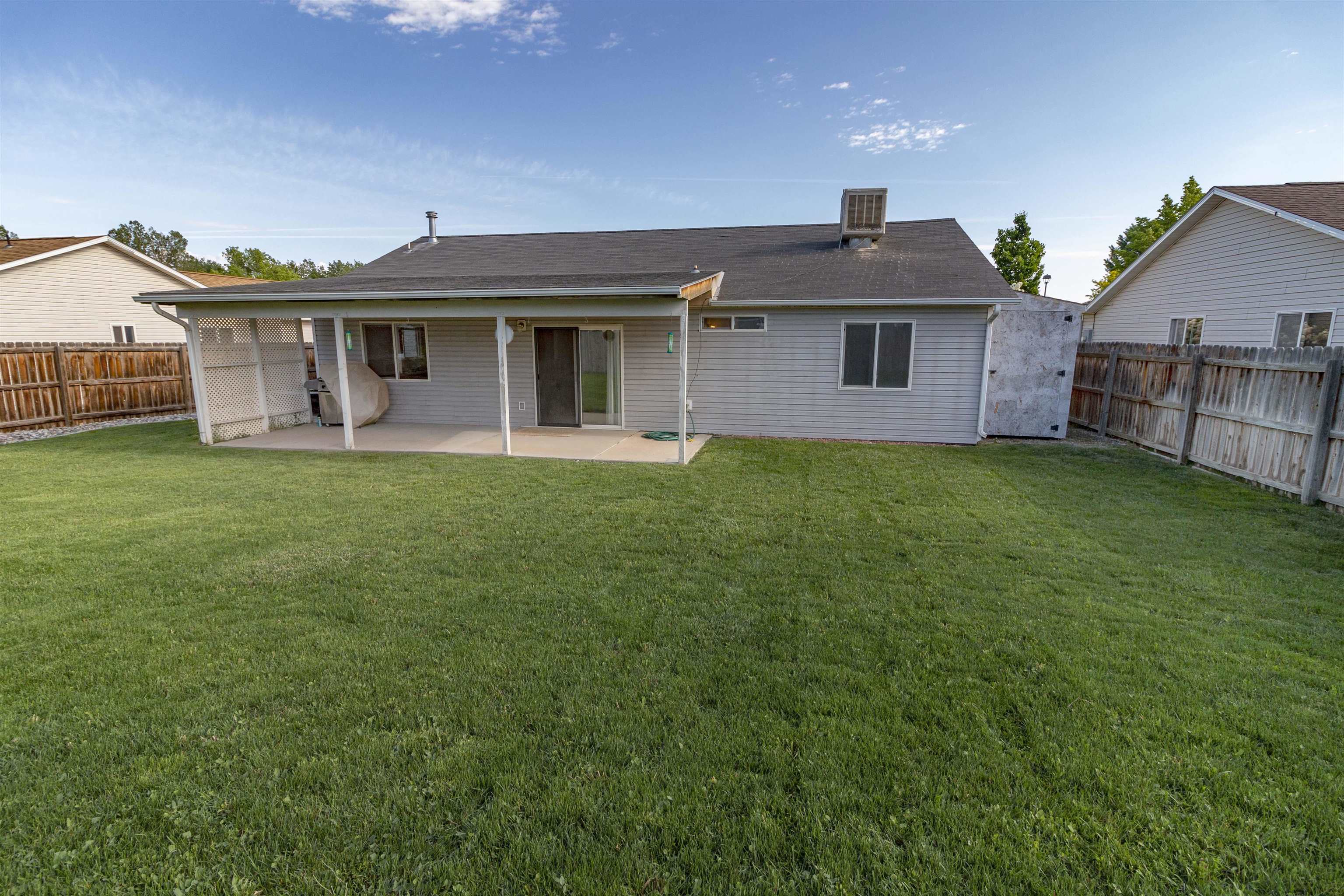 1386 Powell Street Fruita, CO 81521 - Photo 19 of 21 a front view of a house with a garden