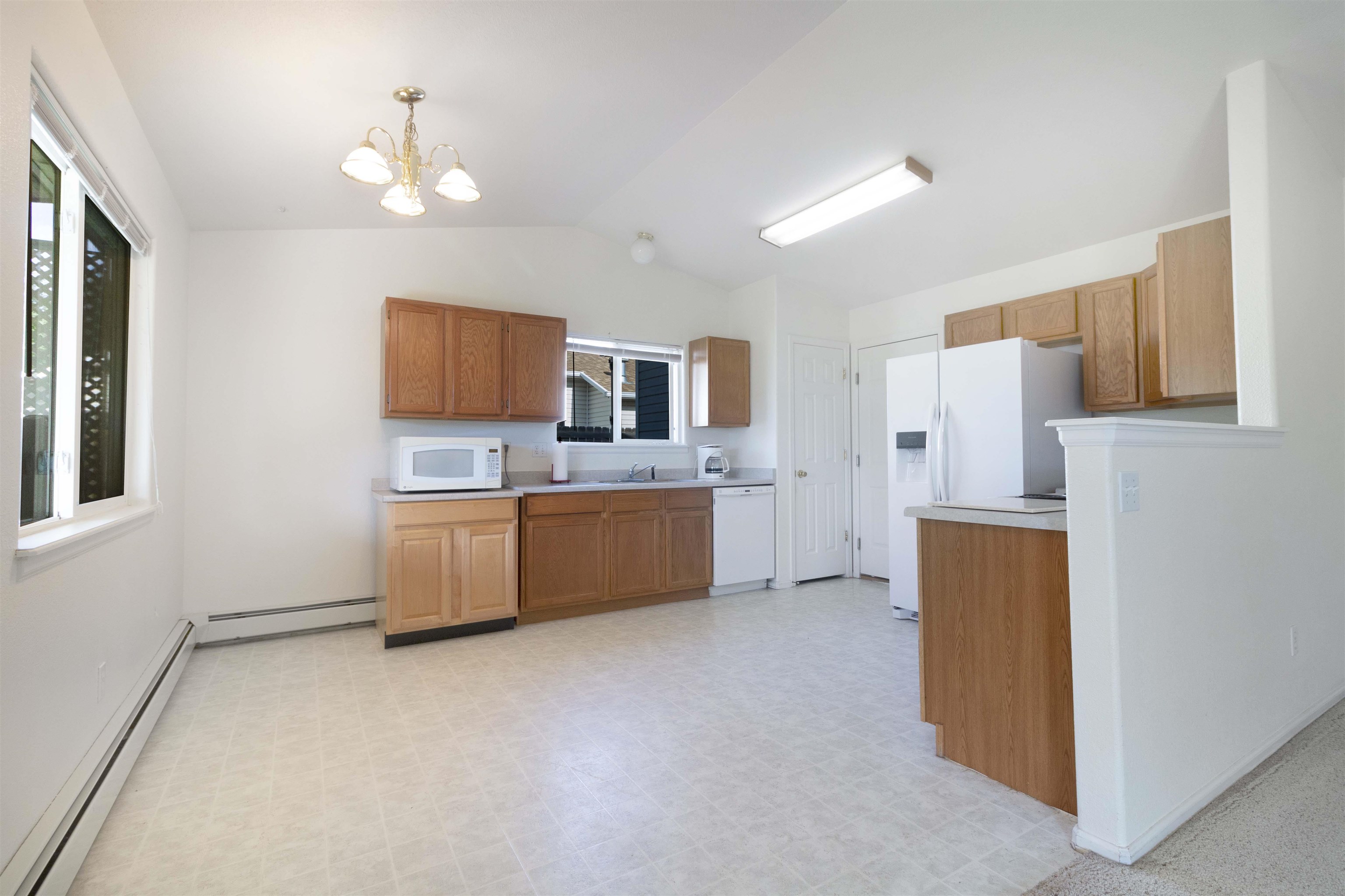 1386 Powell Street Fruita, CO 81521 - Photo 6 of 21 a kitchen with stainless steel appliances a refrigerator sink and cabinets