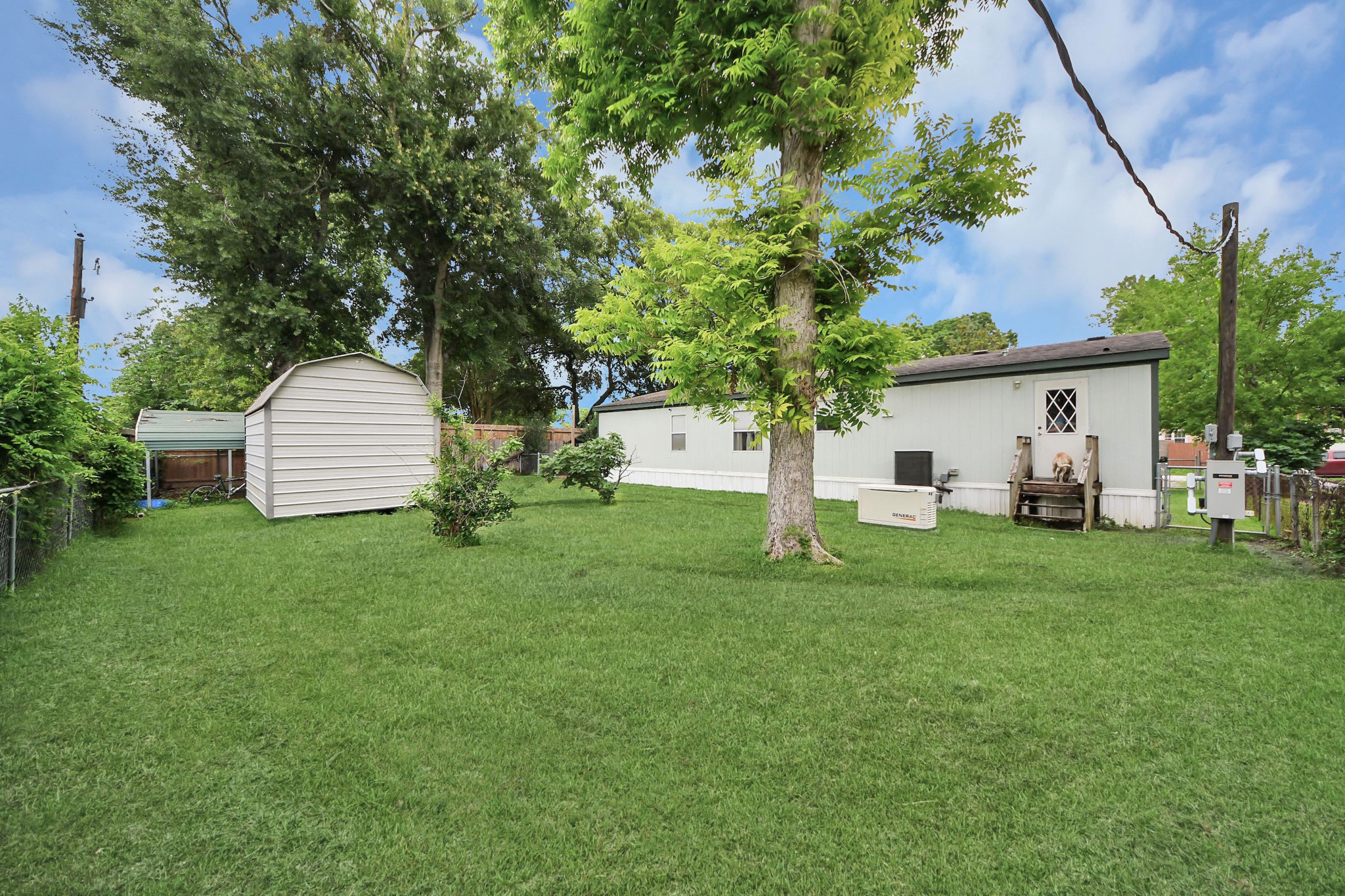 204 Edith Street Highlands, TX 77562 - Photo 28 of 33 a front view of a house with a garden and trees