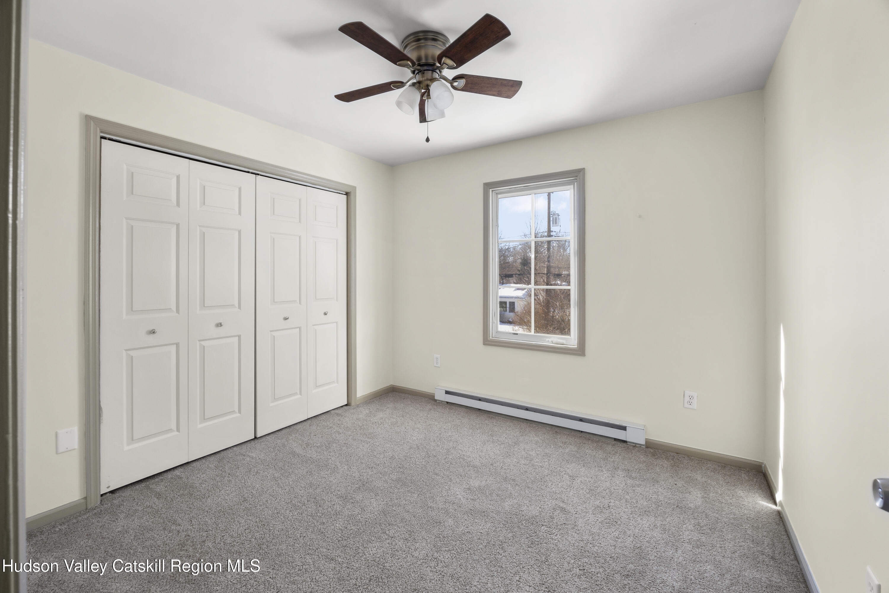 116 Lincoln Road Copake, NY 12516 - Photo 15 of 20 a view of a livingroom with a ceiling fan & window
