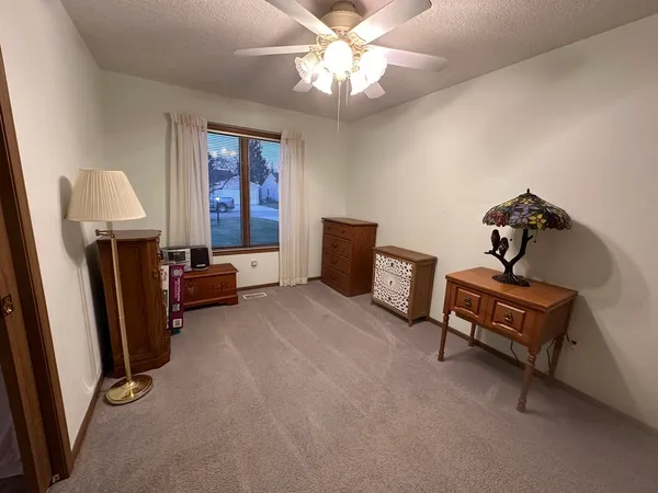 a bedroom with furniture and a window