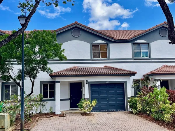 a front view of a house with yellow lighting