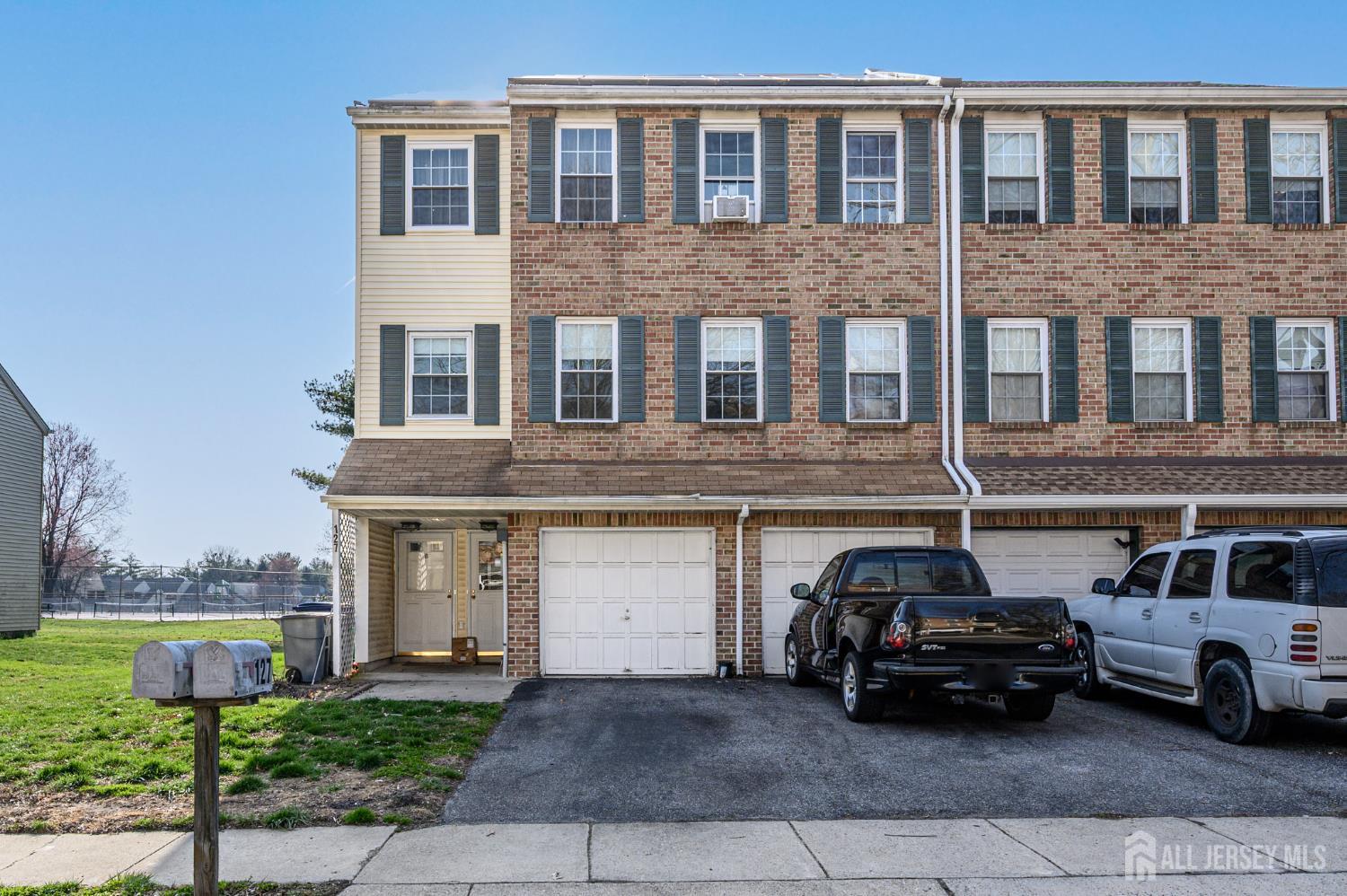 127 Chaucer Road Mount Laurel, NJ 08054 - Photo 1 of 43 a car parked in front of a building