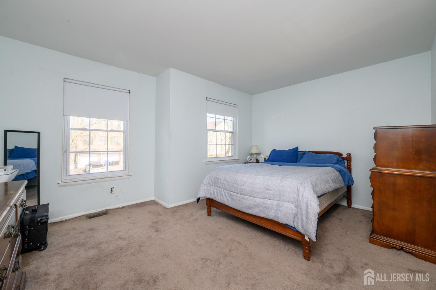 127 Chaucer Road Mount Laurel, NJ 08054 - Photo 15 of 43 a spacious bedroom with a bed and a window