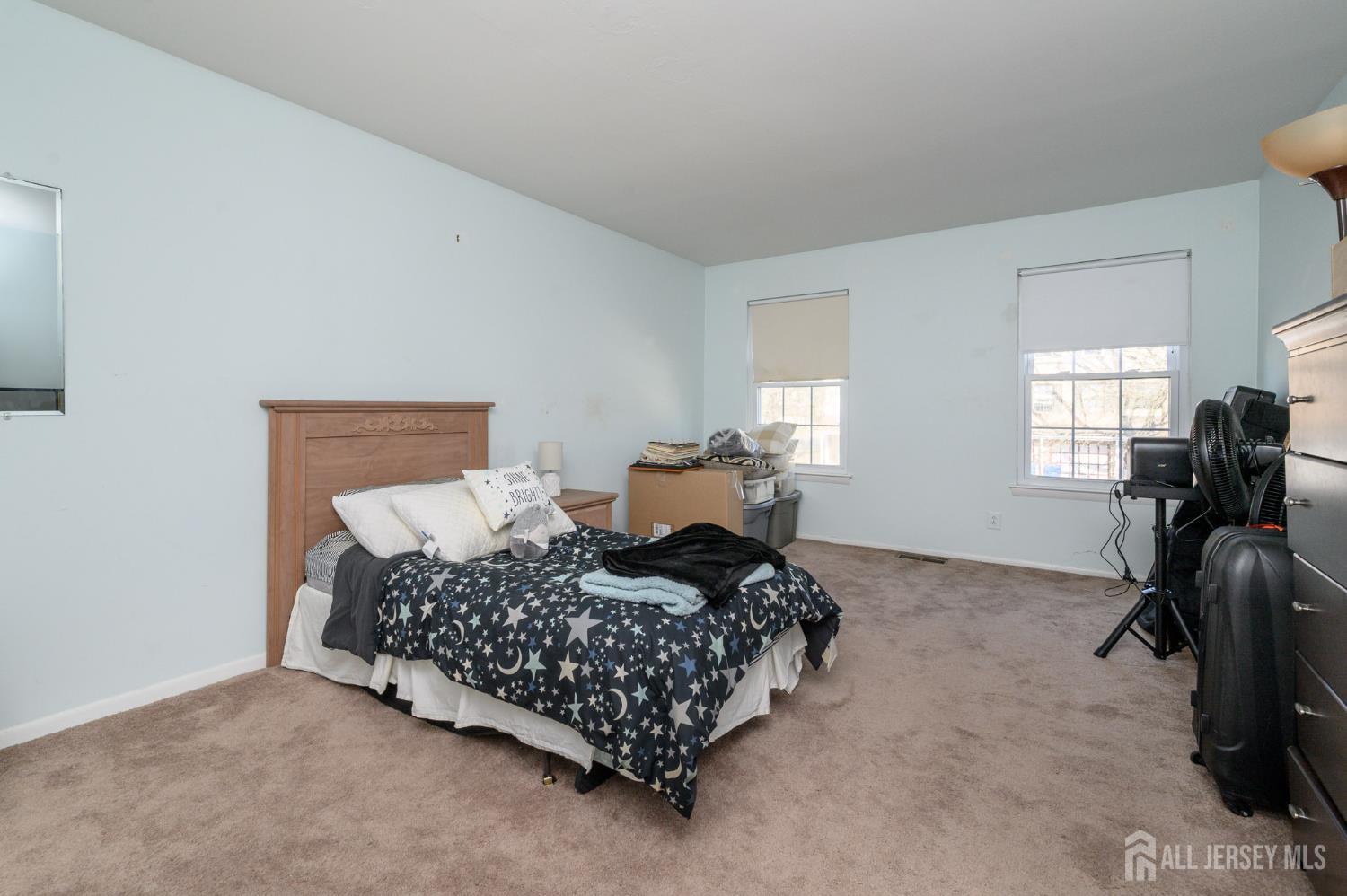 127 Chaucer Road Mount Laurel, NJ 08054 - Photo 17 of 43 a bedroom with a bed and dresser next to a window