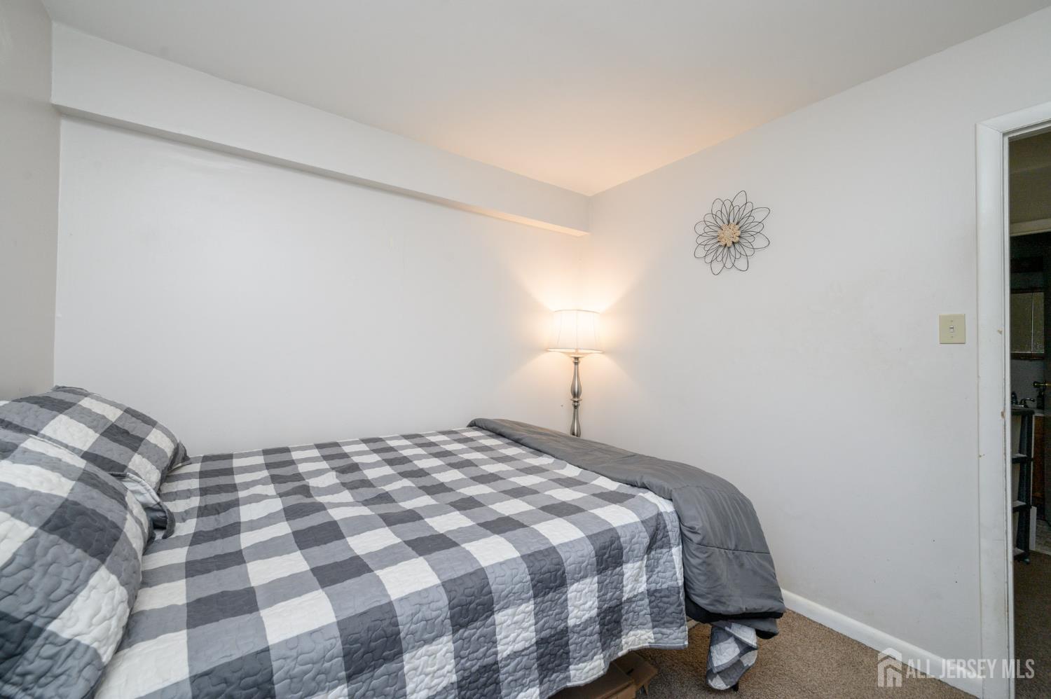 127 Chaucer Road Mount Laurel, NJ 08054 - Photo 34 of 43 a bedroom with a bed and a lamp