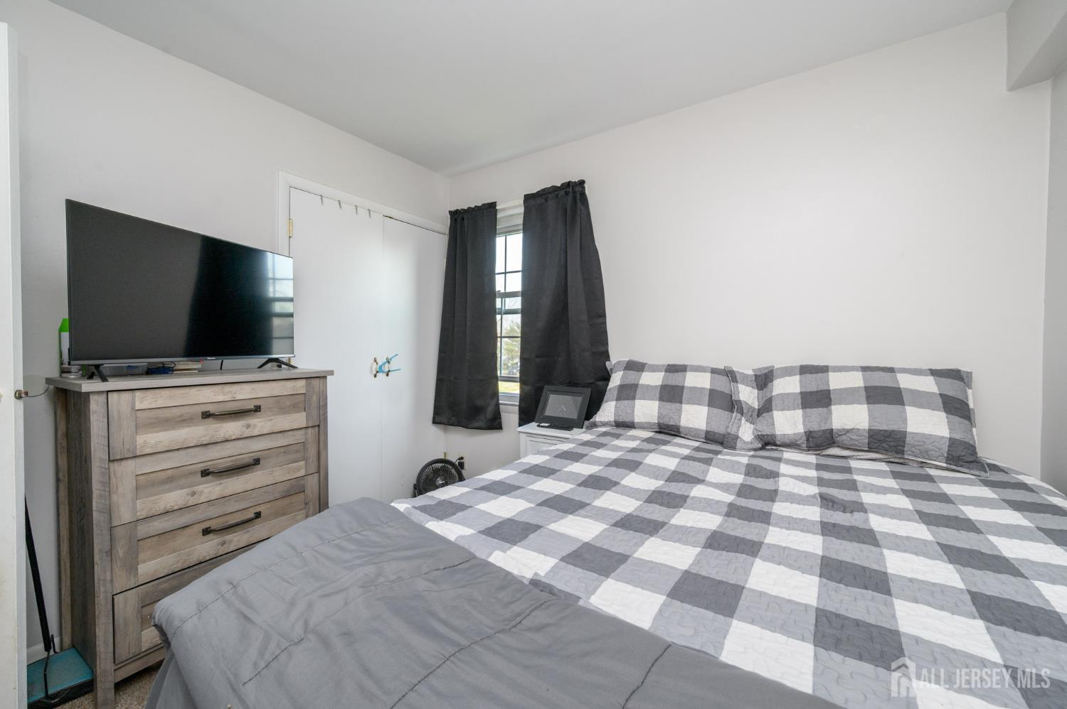 127 Chaucer Road Mount Laurel, NJ 08054 - Photo 35 of 43 a bedroom with a bed and a flat screen tv