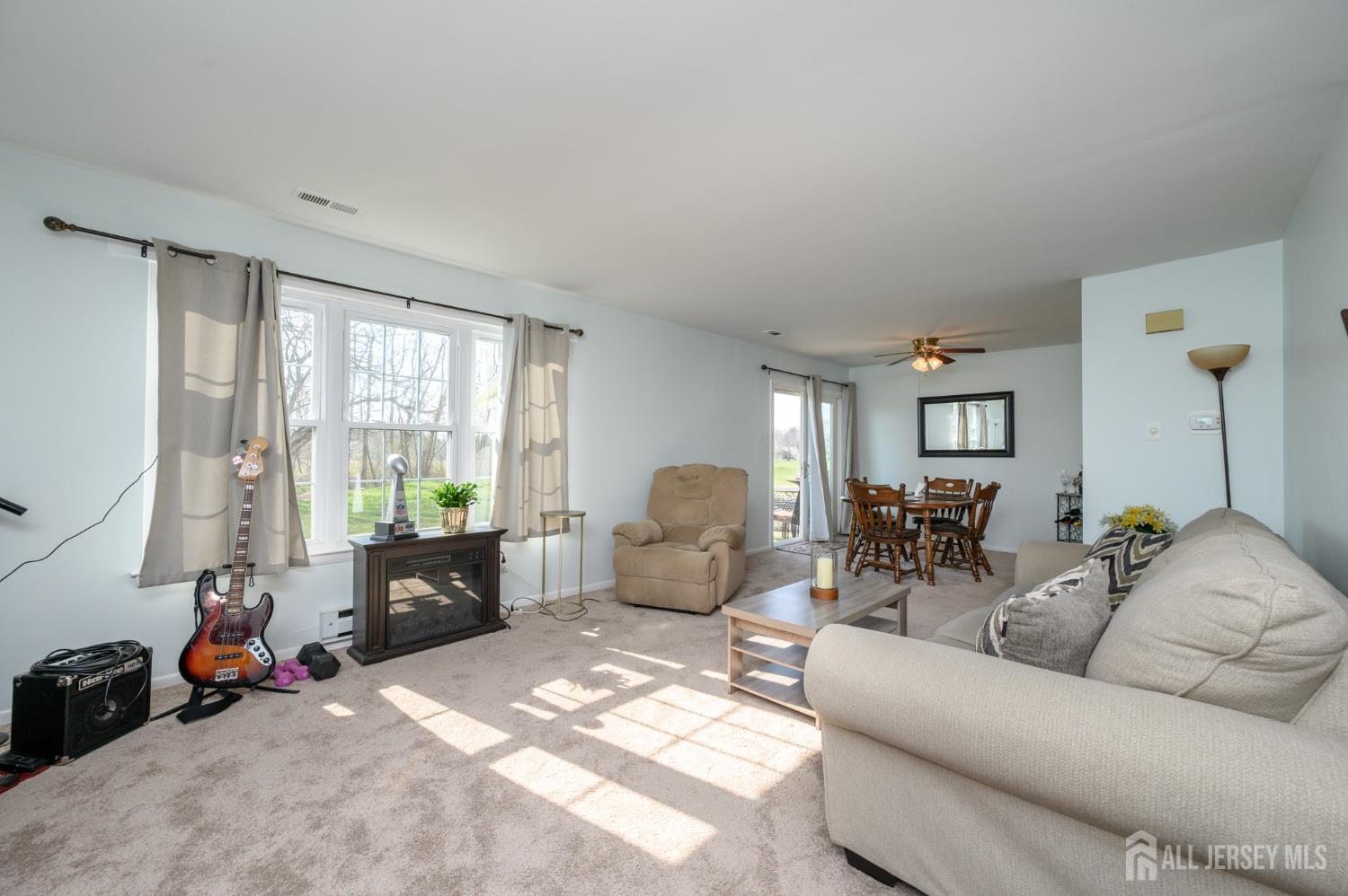 127 Chaucer Road Mount Laurel, NJ 08054 - Photo 4 of 43 a living room with furniture ceiling fan and a window