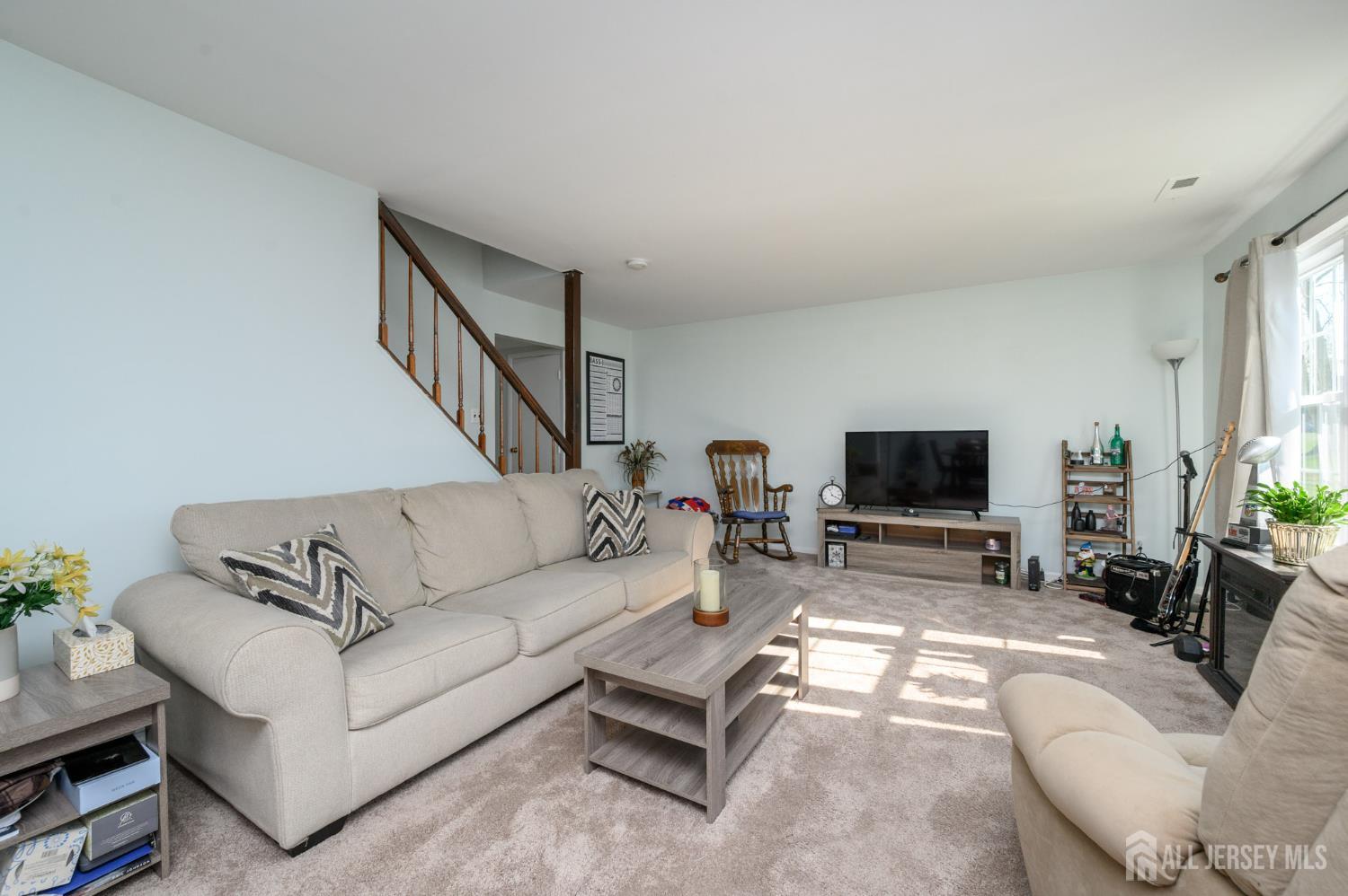 127 Chaucer Road Mount Laurel, NJ 08054 - Photo 6 of 43 a living room with furniture and a flat screen tv