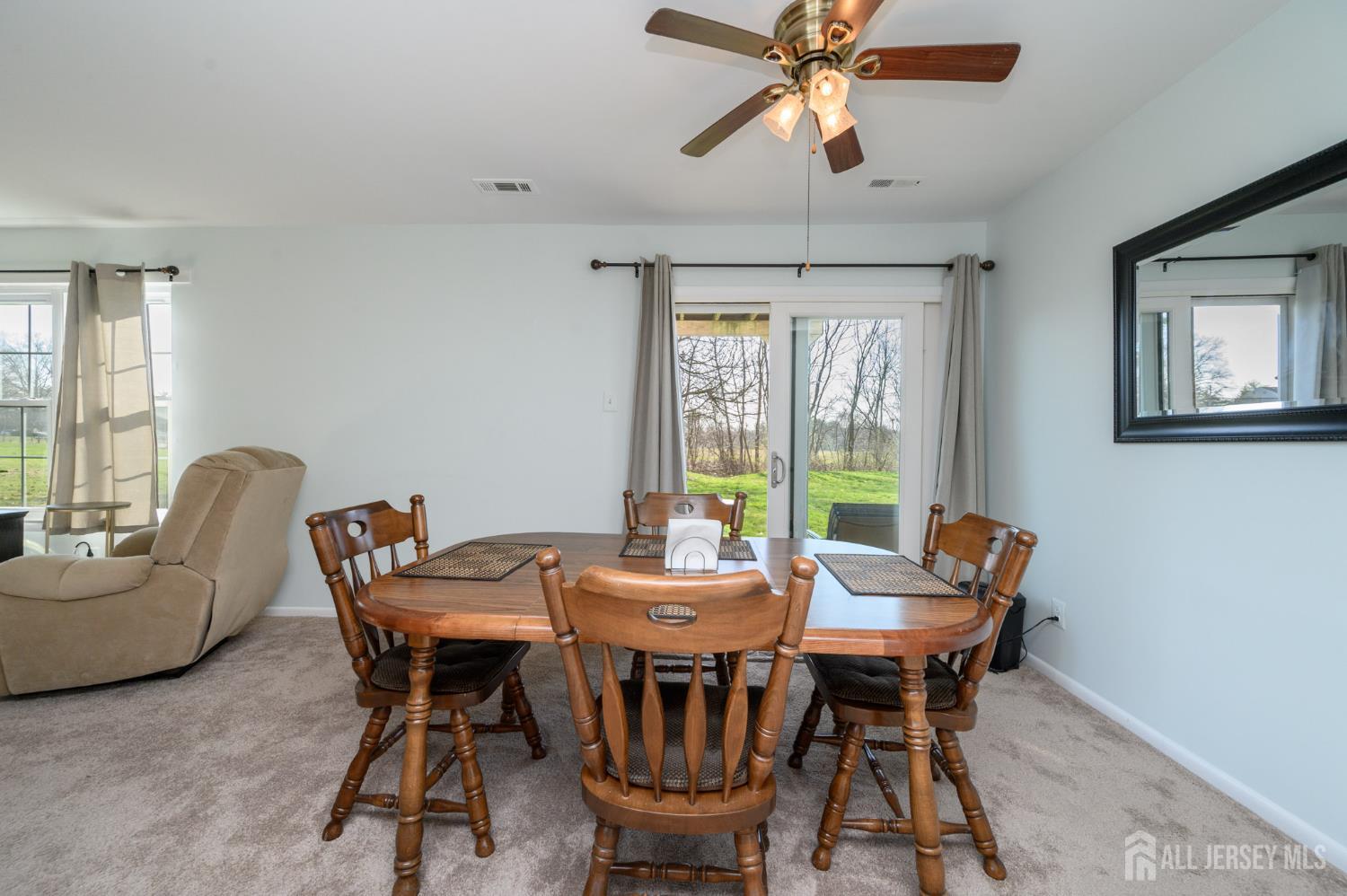 127 Chaucer Road Mount Laurel, NJ 08054 - Photo 8 of 43 a dining room with furniture a chandelier and wooden floor