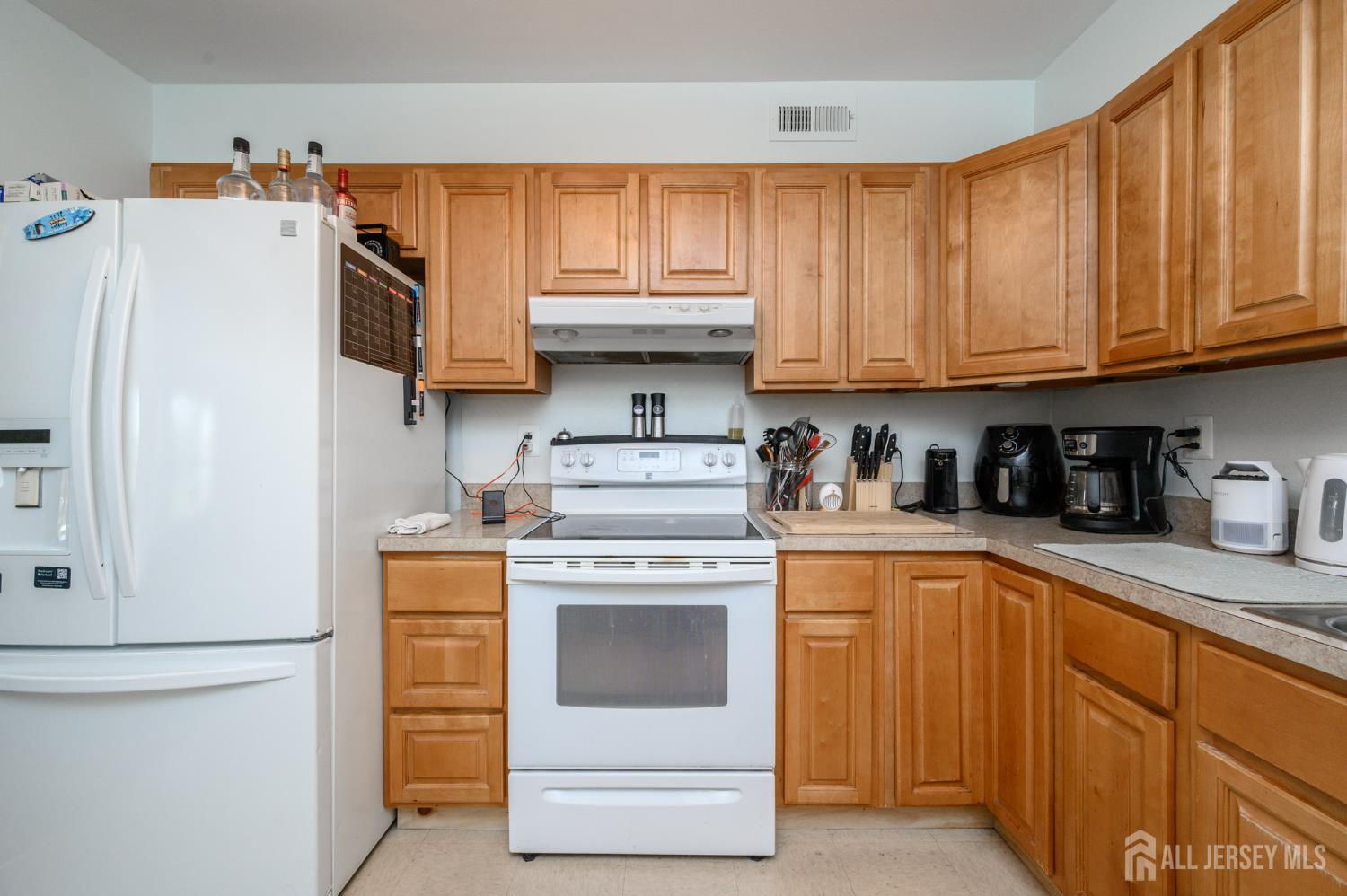 127 Chaucer Road Mount Laurel, NJ 08054 - Photo 10 of 43 a kitchen with granite countertop a white stove top oven and cabinets