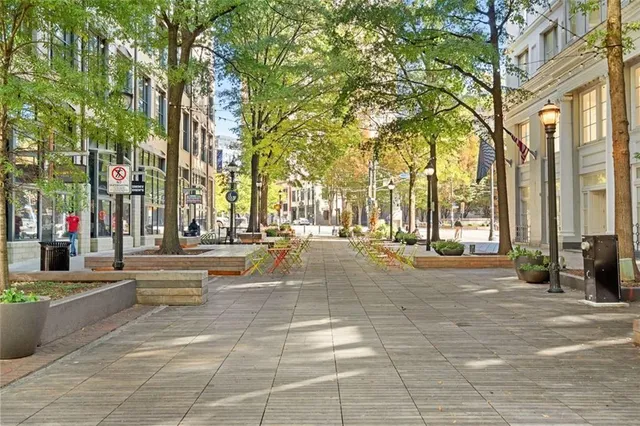 a view of a building with cars parked