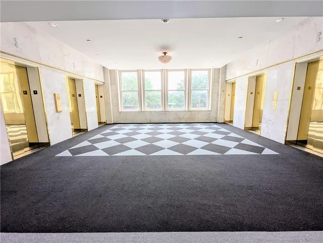 a view of an empty room with a window