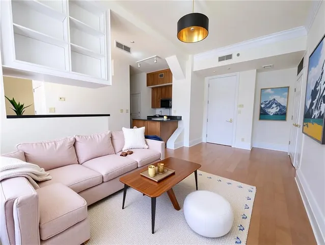 a living room with furniture and a rug