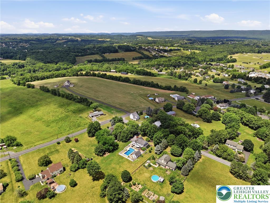 890 Lahr Road Nazareth, PA 18064 - Photo 62 of 71 Rolling green hills and distant woodlands embrace this serene residential landscape, offering tranquil views.